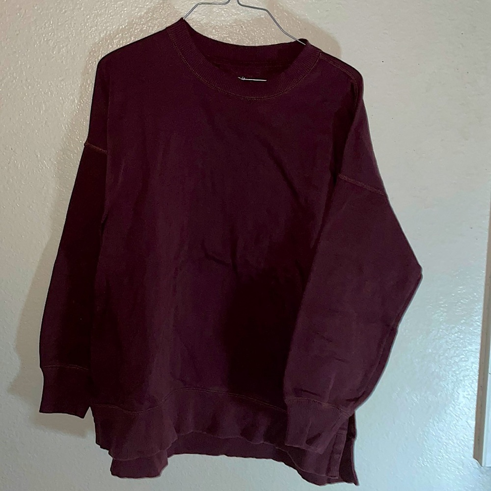 A maroon warm sweatshirt